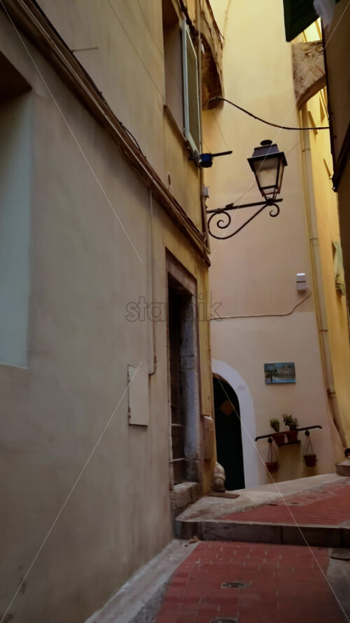 Video - A walk down a narrow street in Menton, France. Vertical