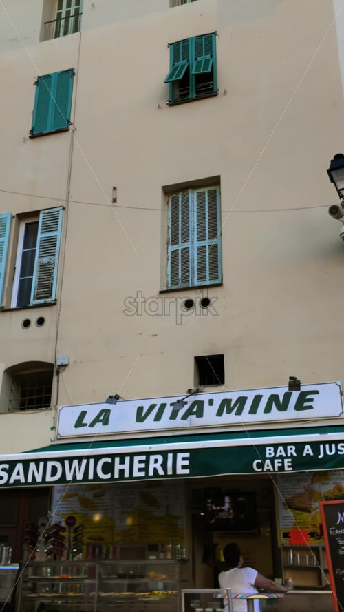 Video - Menton, France - September 4, 2024: People walking on the streets of the city. Vertical