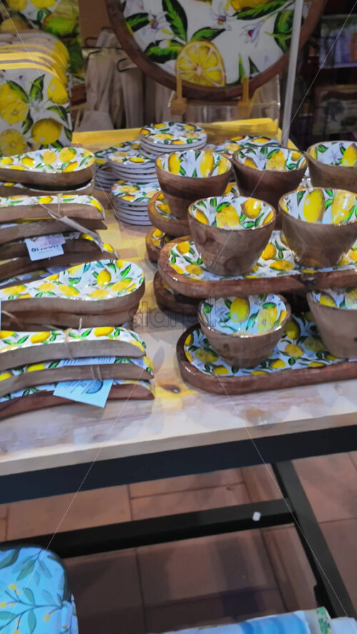 Video - Close up of lemon decorated kitchenware at a store in Menton, France. Vertical