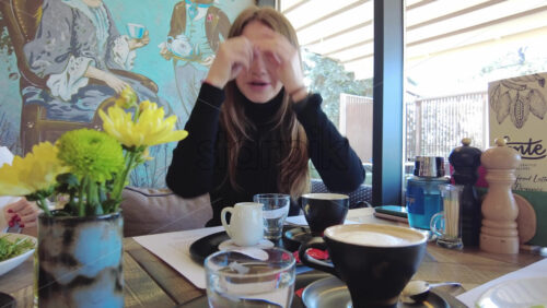 Video - Women talking and drinking coffee at a restaurant