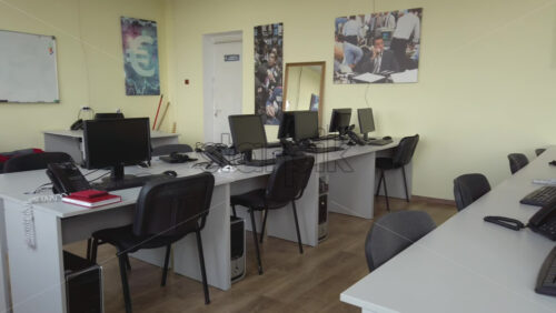 Video - Multiple personal computers on desks at an office