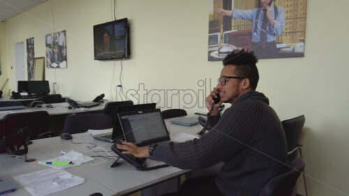 Video - Man speaking on the telephone in an office