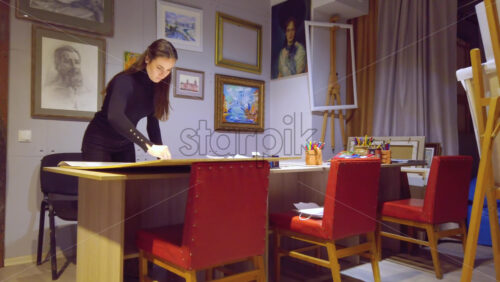 Video - Woman sketching on a canvas at an art gallery workshop