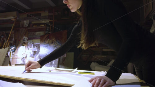 Video - Woman sketching on a canvas at an art gallery workshop