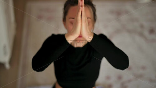 Video - Woman in sportswear doing yoga at home