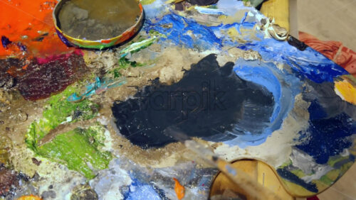 Video - Close up of different colours of paint on a palette