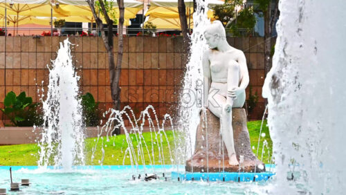 Video - THESSALONIKI, GREECE - SEPTEMBER 21, 2020: An overview on a fountain with a sculpture of a nude woman with a broken leg. An exact representation of human beauty