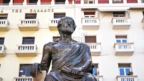 Video - THESSALONIKI, GREECE - SEPTEMBER 21, 2020: Aristotle,a great philosopher and thinker of antiquity. A black statue in a square of him