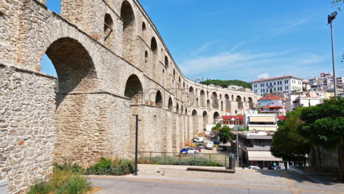 Video - KAVALA, GREECE - SEPTEMBER 23, 2020: Streetscape of the town, viaduct over the roads and buildings, greenery