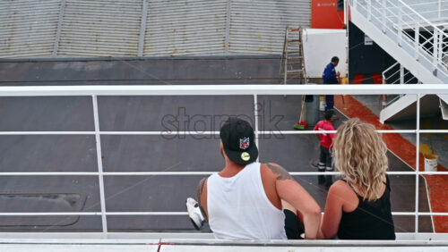 Video - THASOS, GREECE - SEPTEMBER 23, 2020: A couple sitting, talking and eating on a floating ferryboat