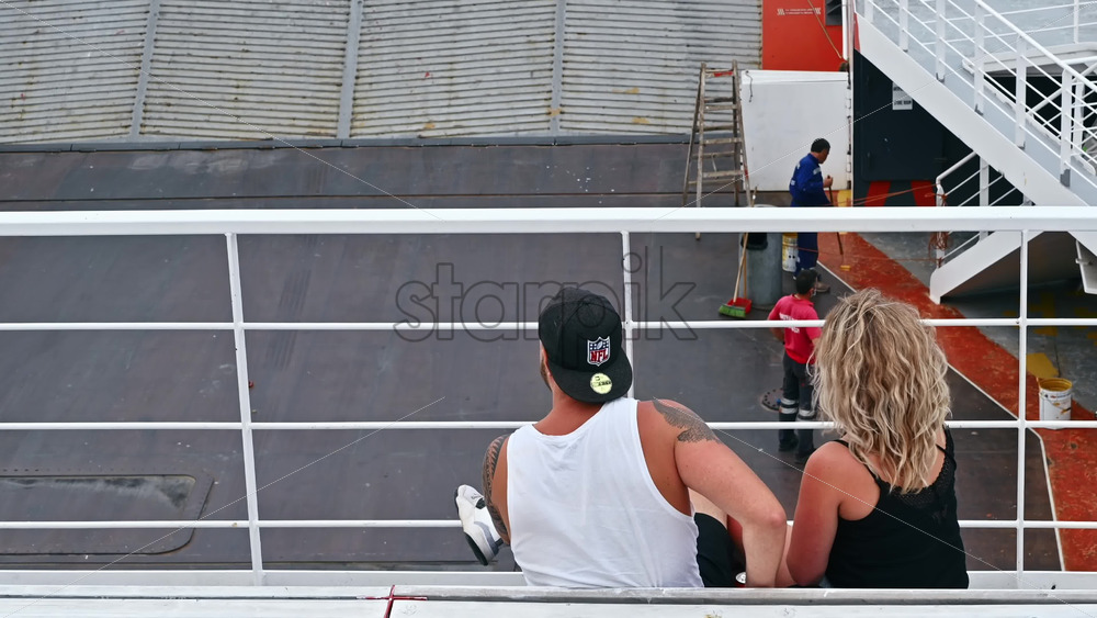 Video - THASOS, GREECE - SEPTEMBER 23, 2020: A couple sitting, talking and eating on a floating ferryboat