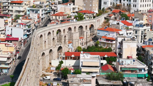 Video - KAVALA, GREECE - SEPTEMBER 23, 2020: Aerial view of the town. Rows of residential buildings , viaduct, roads