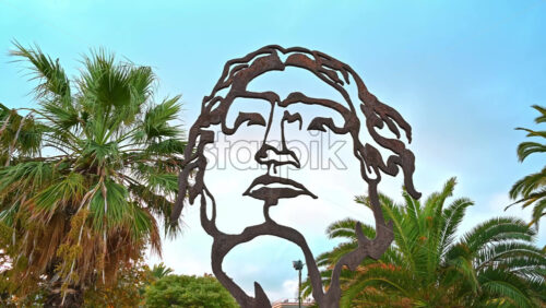 Video - STAVROS, GREECE - SEPTEMBER 26, 2020: Human Head Art installation of a head with palms and sky on the background