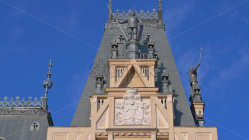 Video - Iasi, Romania - April 25, 2021: Close up of pink magnolia trees in front of the Palace of Culture