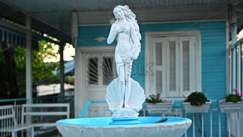 Video - STAVROS, GREECE - SEPTEMBER 26, 2020: Statue of a woman made of stone in greek style on a yard of a house