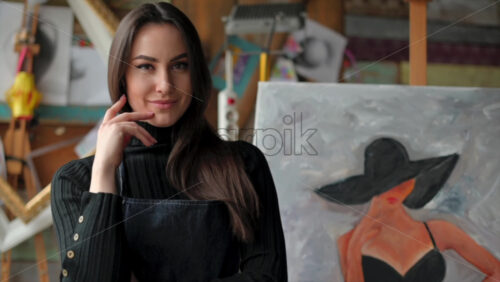 Video - Woman standing in front of a painting at an art gallery workshop