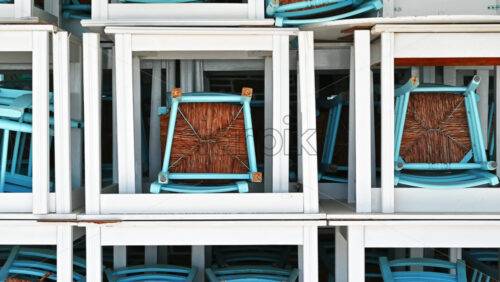 Video - Terrace of a restaurant with multiple assembled chairs and tables in Nikiti, Greece. Zooming out effect
