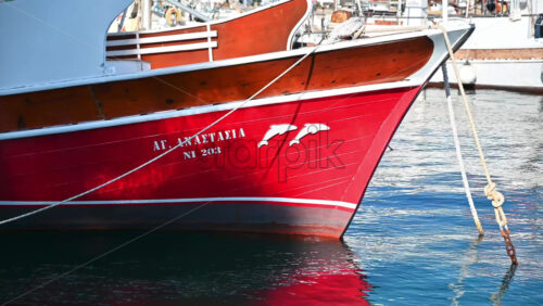 Video - NEOS MARMARAS, GREECE - OCTOBER 8, 2020: The bow of the vintage yacht made of wood in the sea port