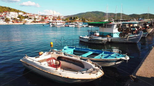 Video - NEOS MARMARAS, GREECE - OCTOBER 8, 2020: Aegean sea port with multiple moored yachts and boats, clear weather. Slow motion