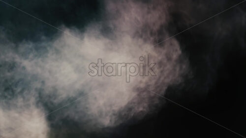 A jet of water spraying into the air against a dark background - Starpik Stock