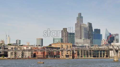 A scenic view of London’s iconic skyline along the River Thames, London, England - Starpik Stock