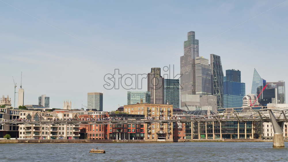 A scenic view of London’s iconic skyline along the River Thames, London, England - Starpik Stock