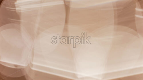 Abstract composition of light trails and overlapping bokeh in warm golden tones - Starpik Stock
