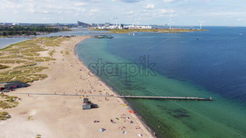 Aerial drone view of Amager Strandpark beach and dunes, with the Copenhagen skyline visible in the distance - Starpik Stock