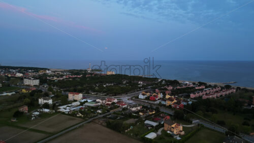 Aerial drone view of Cavallino-Treporti in the Venetian Lagoon in northern Italy in the evening - Starpik Stock