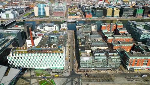 Aerial drone view of Dublin Docklands featuring the iconic Samuel Beckett Bridge and Convention Centre Dublin - Starpik Stock