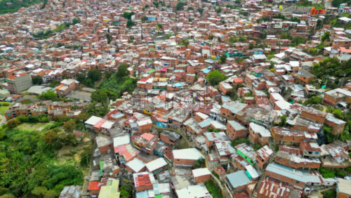 Aerial drone view of Medellin, historic hillside town in Colombia in daylight - Starpik Stock
