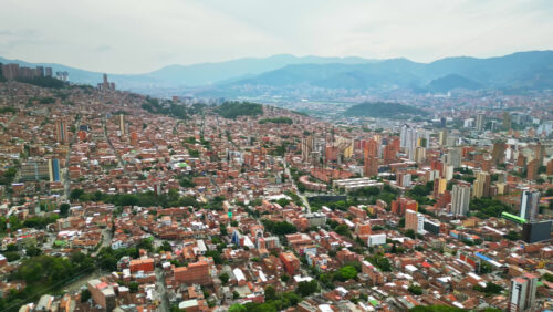 Aerial drone view of Medellin, historic hillside town in Colombia in daylight - Starpik Stock