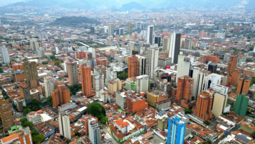 Aerial drone view of Medellin, historic hillside town in Colombia in daylight - Starpik Stock
