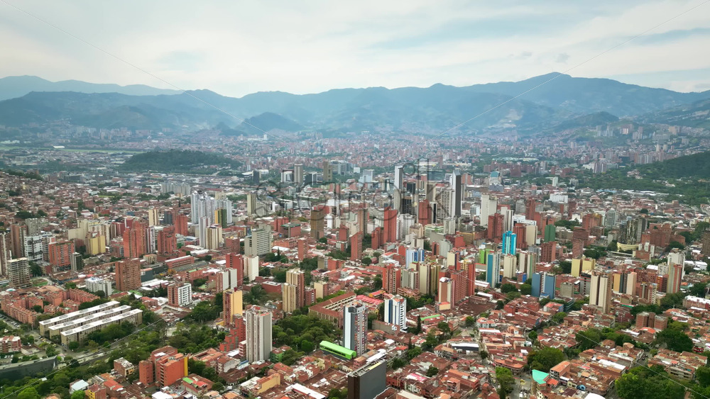 Aerial drone view of Medellin, historic hillside town in Colombia in daylight - Starpik Stock