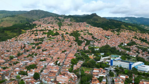 Aerial drone view of Medellin, historic hillside town in Colombia in daylight - Starpik Stock