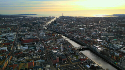 Aerial drone view of bridges over the River Liffey in Dublin, Ireland in daylight - Starpik Stock