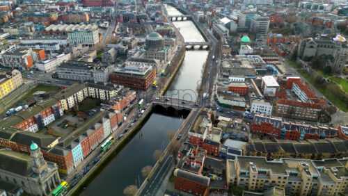 Aerial drone view of bridges over the River Liffey in Dublin, Ireland in daylight - Starpik Stock