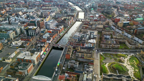 Aerial drone view of bridges over the River Liffey in Dublin, Ireland in daylight - Starpik Stock