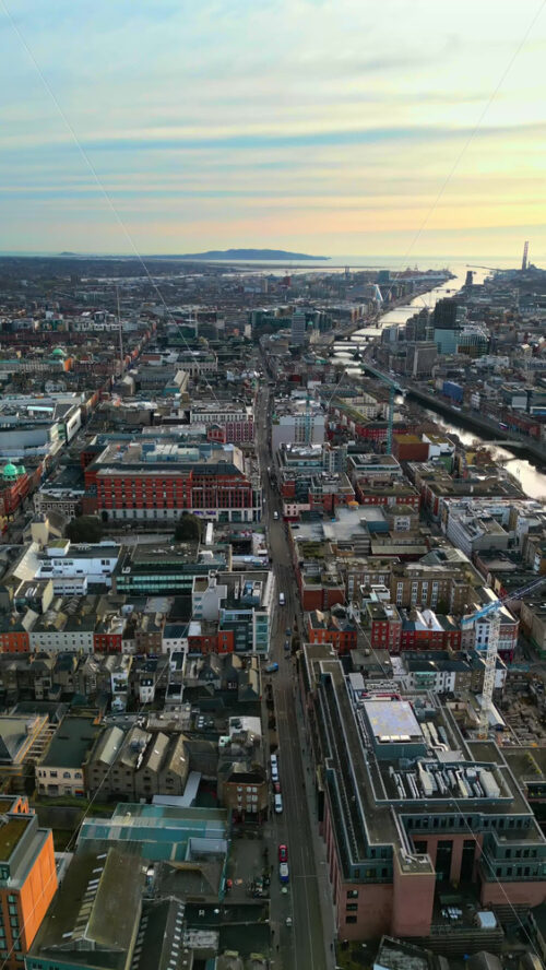 Aerial drone view of bridges over the River Liffey in Dublin, Ireland in daylight. Vertical - Starpik Stock