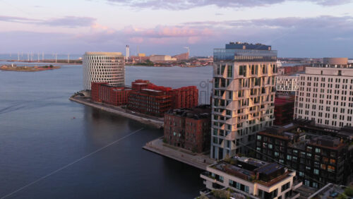 Aerial drone view of modern waterfront apartments in Nordhavn, Copenhagen, Denmark - Starpik Stock