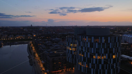 Aerial drone view of the Axel Towers, modern round glass buildings in Copenhagen, Denmark - Starpik Stock