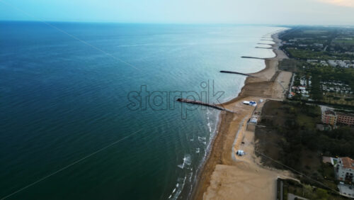 Aerial drone view of the Cavallino-Treporti beach on the Adriatic Coast in the evening - Starpik Stock