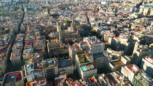 Aerial drone view of the Gothic Quarter in Barcelona, Spain, with the iconic Barcelona Cathedral standing at the center - Starpik Stock
