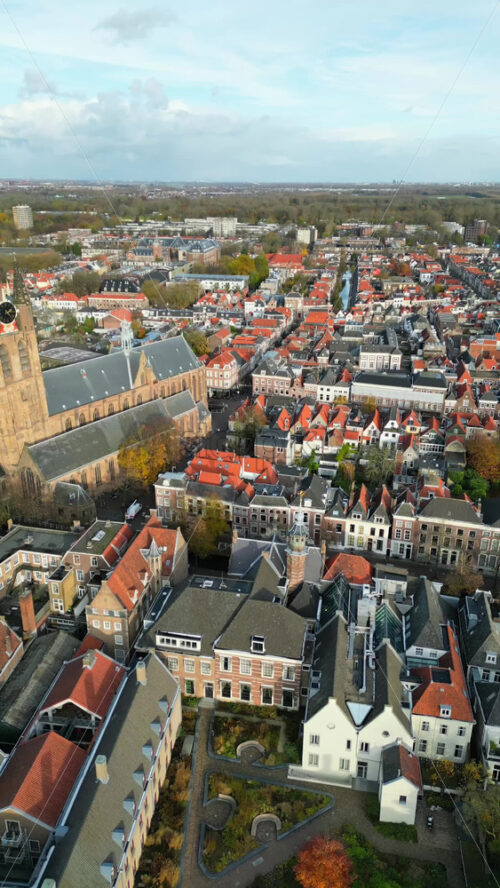 Aerial drone view of the Nieuwe Kerk Protestant church in the city of Delft in the Netherlands. Vertical - Starpik Stock