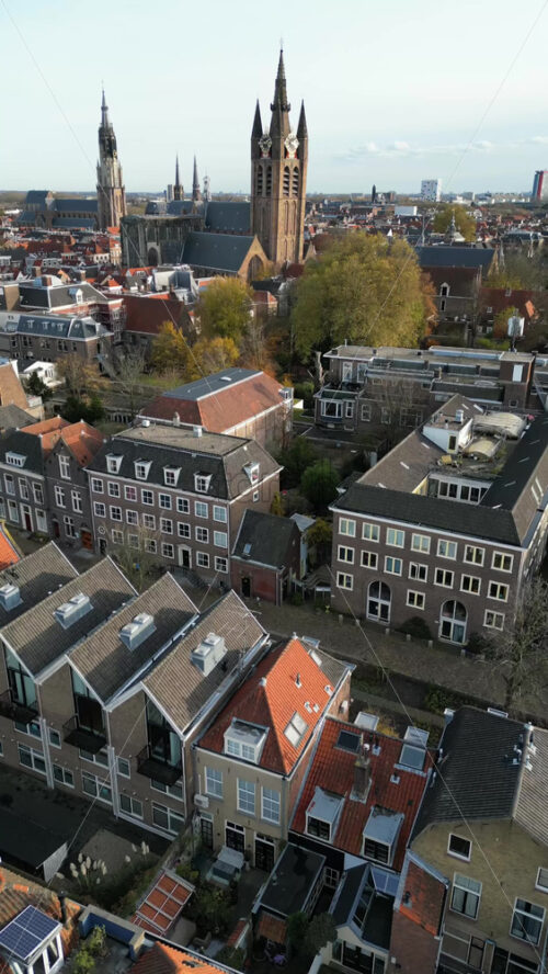 Aerial drone view of the Nieuwe Kerk Protestant church in the city of Delft in the Netherlands. Vertical - Starpik Stock