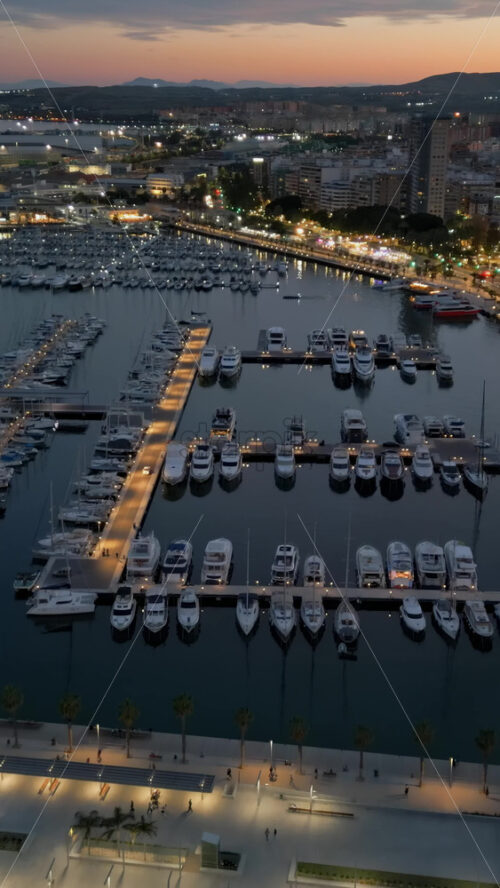 Aerial drone view of the Port of Alicante at sunset. Vertical - Starpik Stock