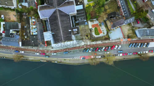 Aerial drone view of the River Liffey in Dublin, showing bus lanes, and riverside buildings - Starpik Stock