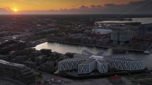 Aerial drone view of the UN City Copenhagen star-shaped building by the harbor in Denmark - Starpik Stock