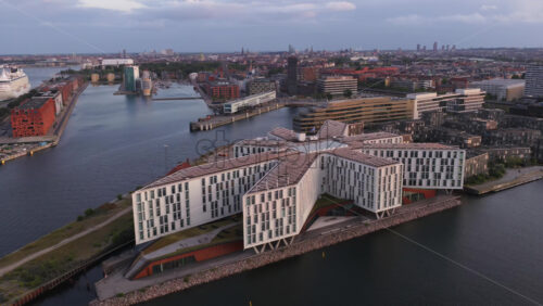 Aerial drone view of the UN City Copenhagen star-shaped building by the harbor in Denmark - Starpik Stock