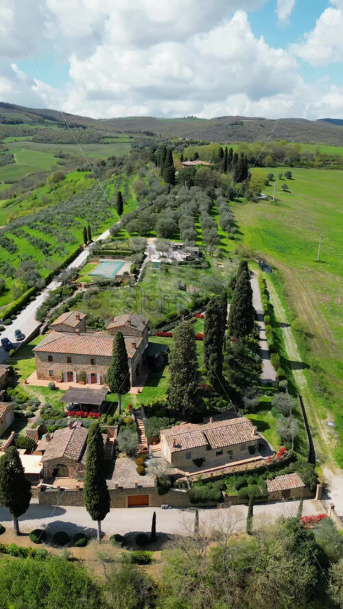 Aerial drone view of the Valdorcia region in Tuscany, central Italy. Vertical - Starpik Stock